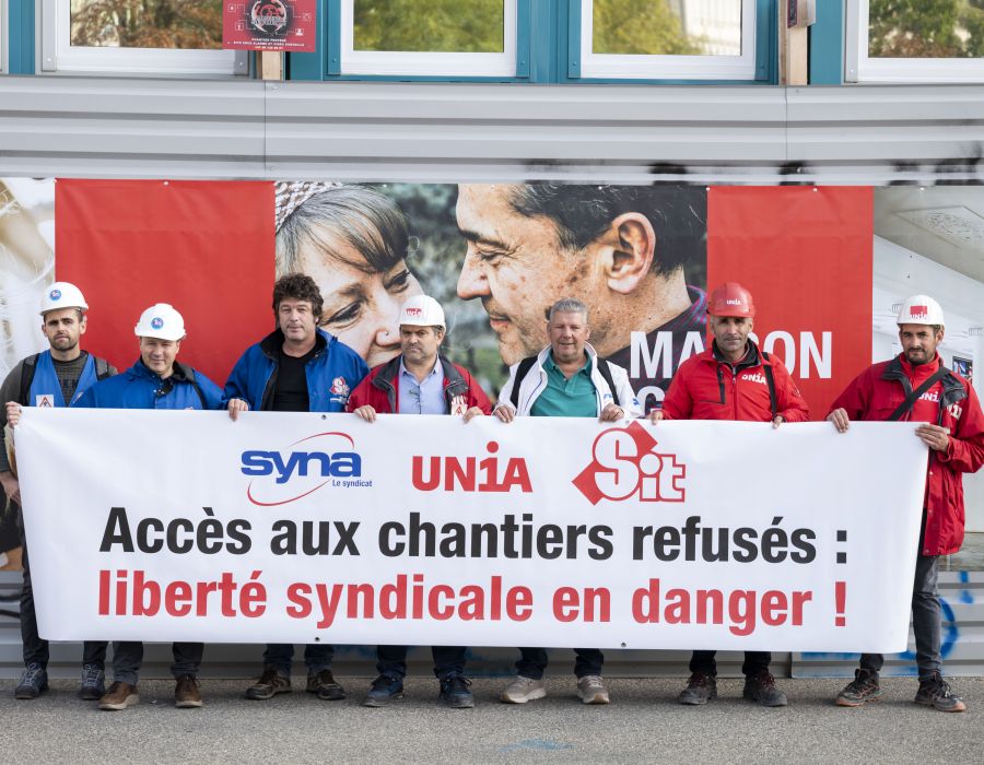 Action sur les chantiers d'Unia Genève avec une banderole